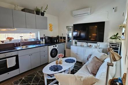 Mysigt attefallshus med loft i Askim